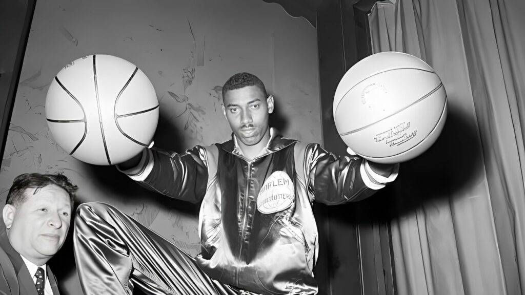 Wilt Chamberlain Holding Two Basketballs